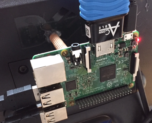 Hot glue holding on PI to back of the monitor with wooden dowels